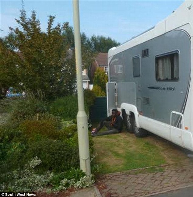 Teenager emerges from the bottom of the motorhome