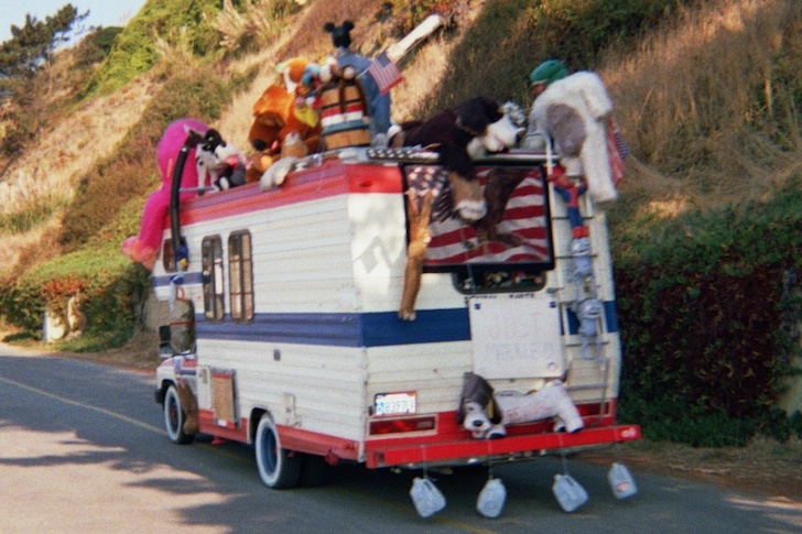 Back of a Toyota RV with stuffed animals and a Just Married sign