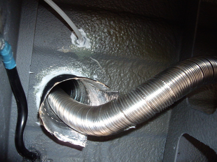 Exhaust pipe inside the intake pipe for a diesel cook top in Sprinter van