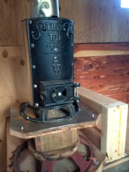 Tiny Tot wood stove in truck camper