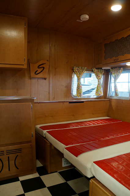 You'll find a full size bed in the front and twin bed in the rear of the trailer