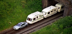 Camper vans turned into train cars