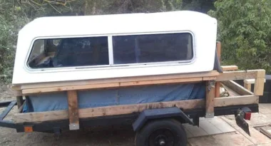 Homemade pop-up camper on a Harbor Freight utility trailer