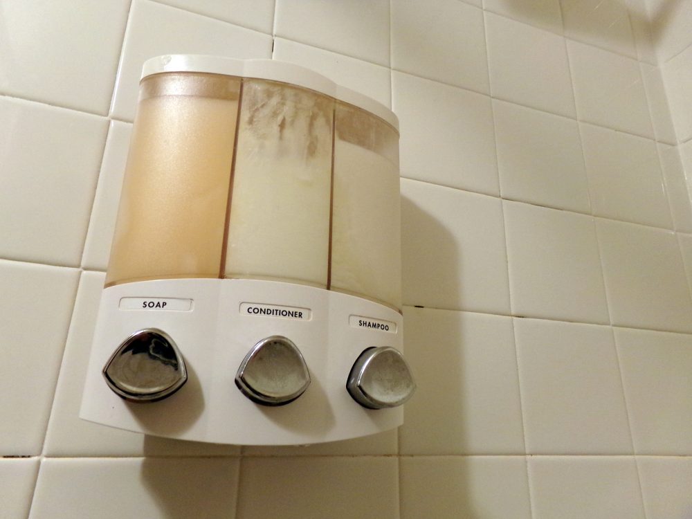 Dispensers can hold soap, shampoo, and conditioner. Photo by author
