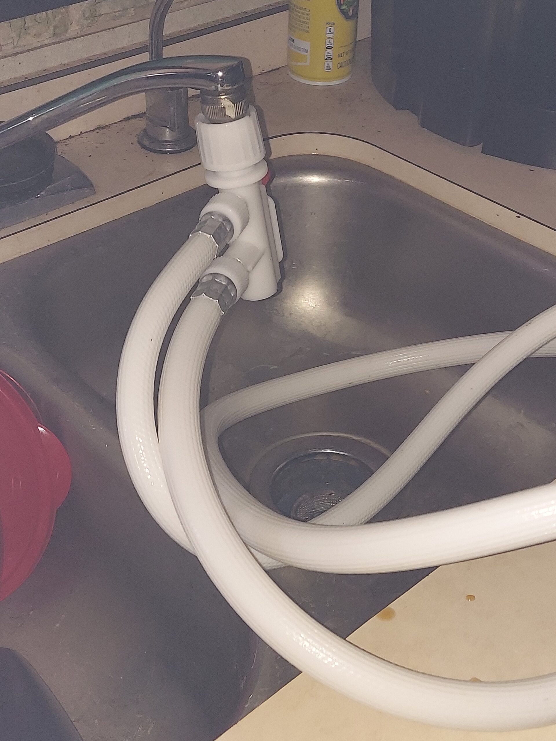 Sink with dishwasher hoses