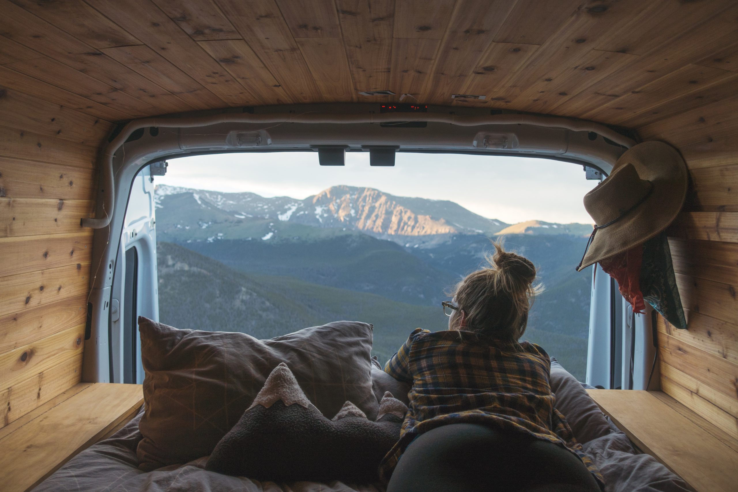 Overlooking a mountain from a camper van with pine interior - DIY camper van