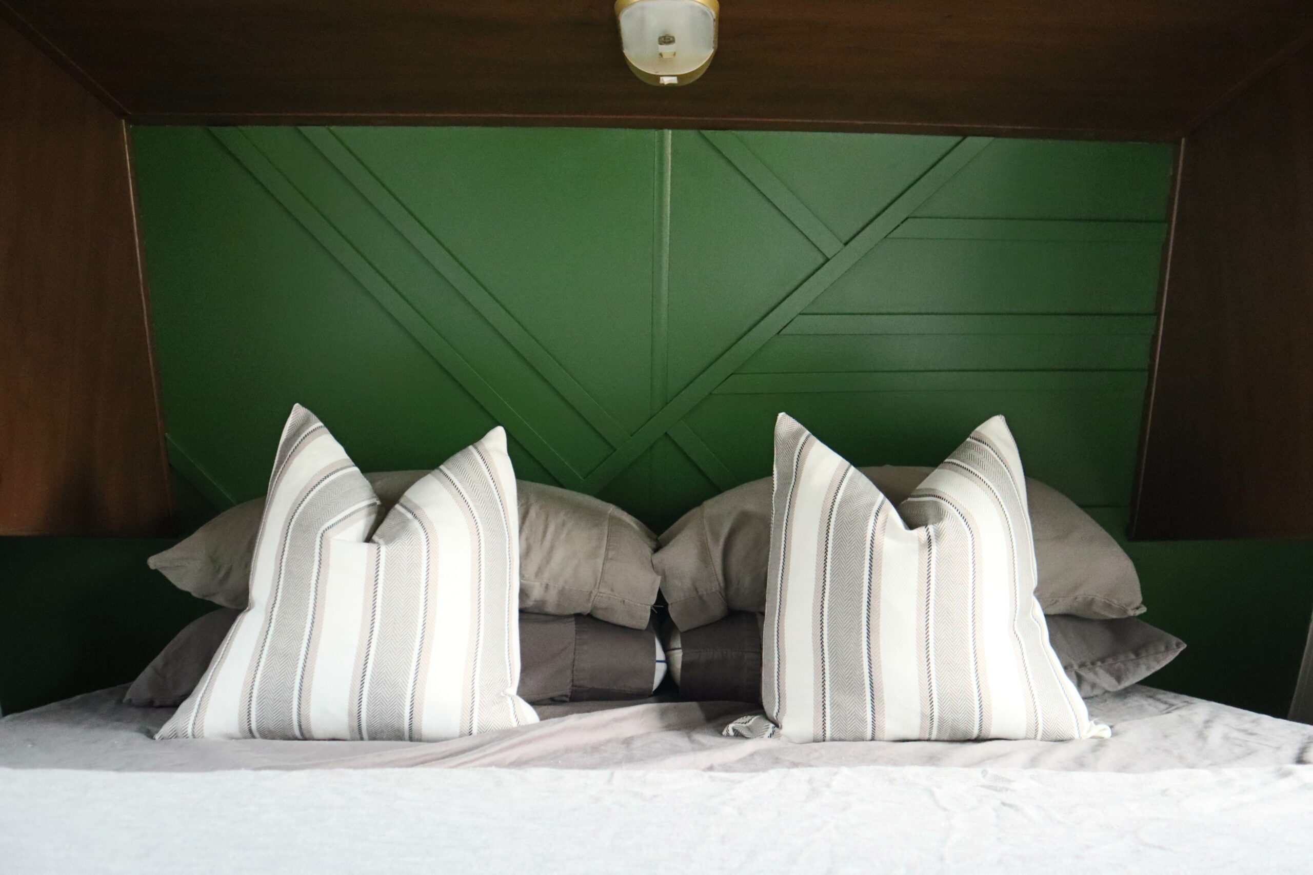 Emerald green feature wall in RV bedroom