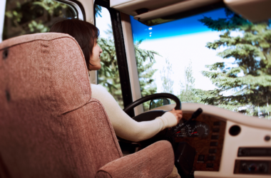 Women at the wheel of a motorhome driving down the road - RV captain's chairs