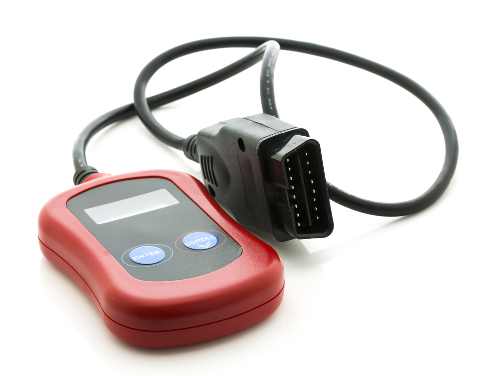 An obd2 scanner on white background.