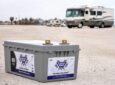 RV batteries in front of motorhome