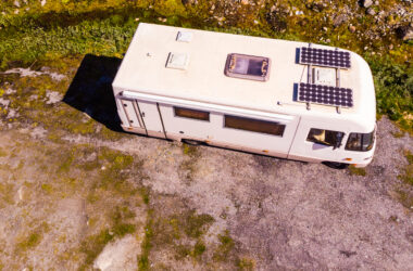 aerial view of RV with solar panels - feature image for How To Hook Up Solar Panels To RV Batteries