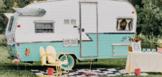 vintage RV with outdoor setup - feature image for Is There Money In Flipping RVs?