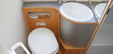 RV bathroom with toilet and sink - feature image for What Can I Use To Unclog My RV Toilet?
