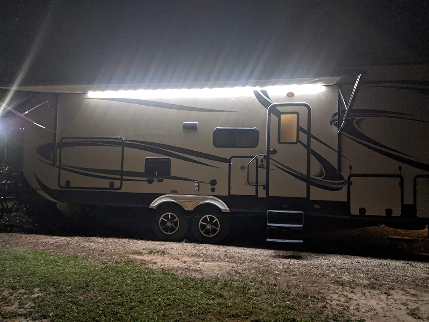 RV LED lights on a camper at night 