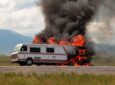 An rv catches fire on the side of the road