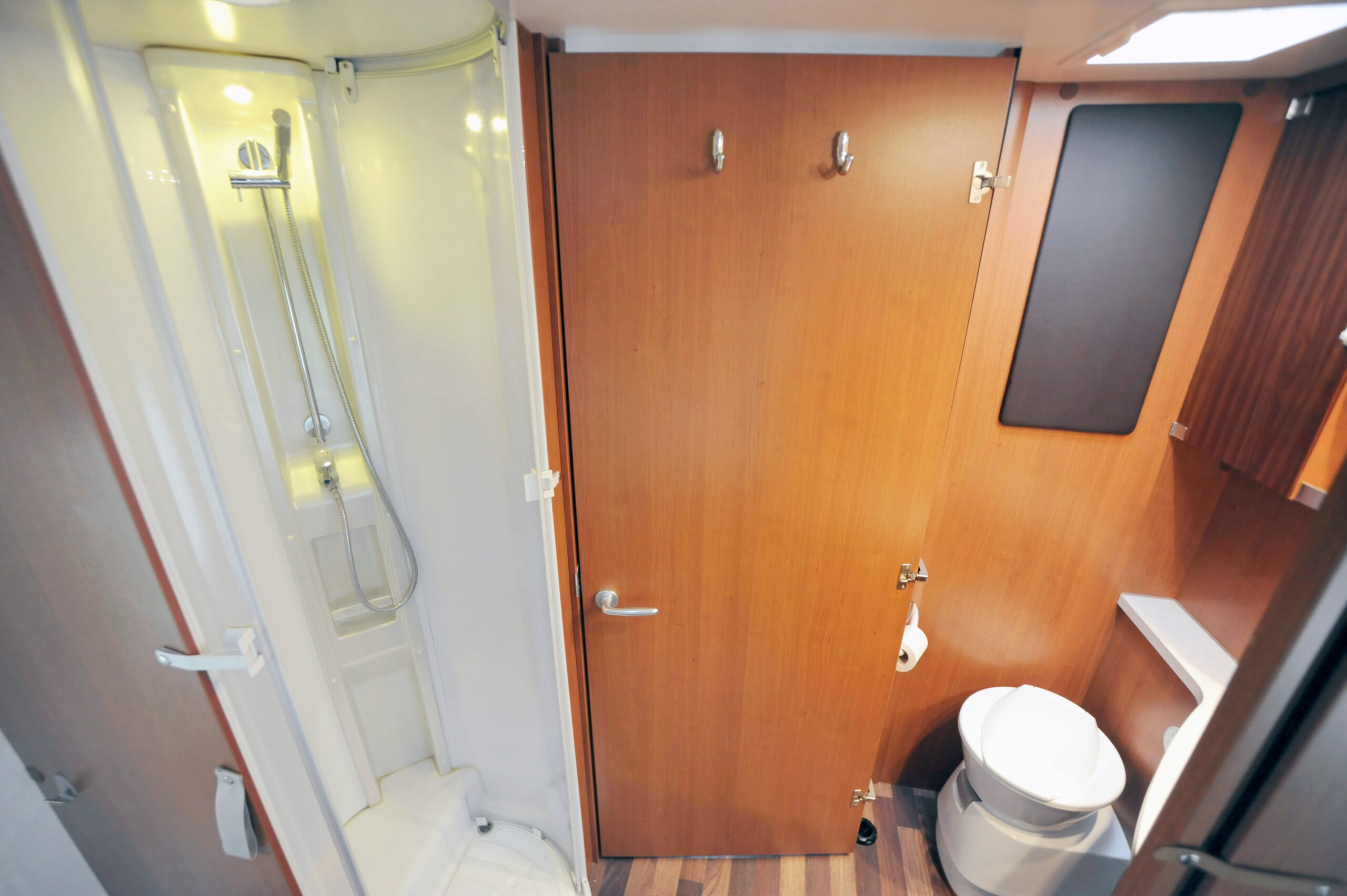 RV shower and toilet - feature image for How To Remodel An RV Shower
