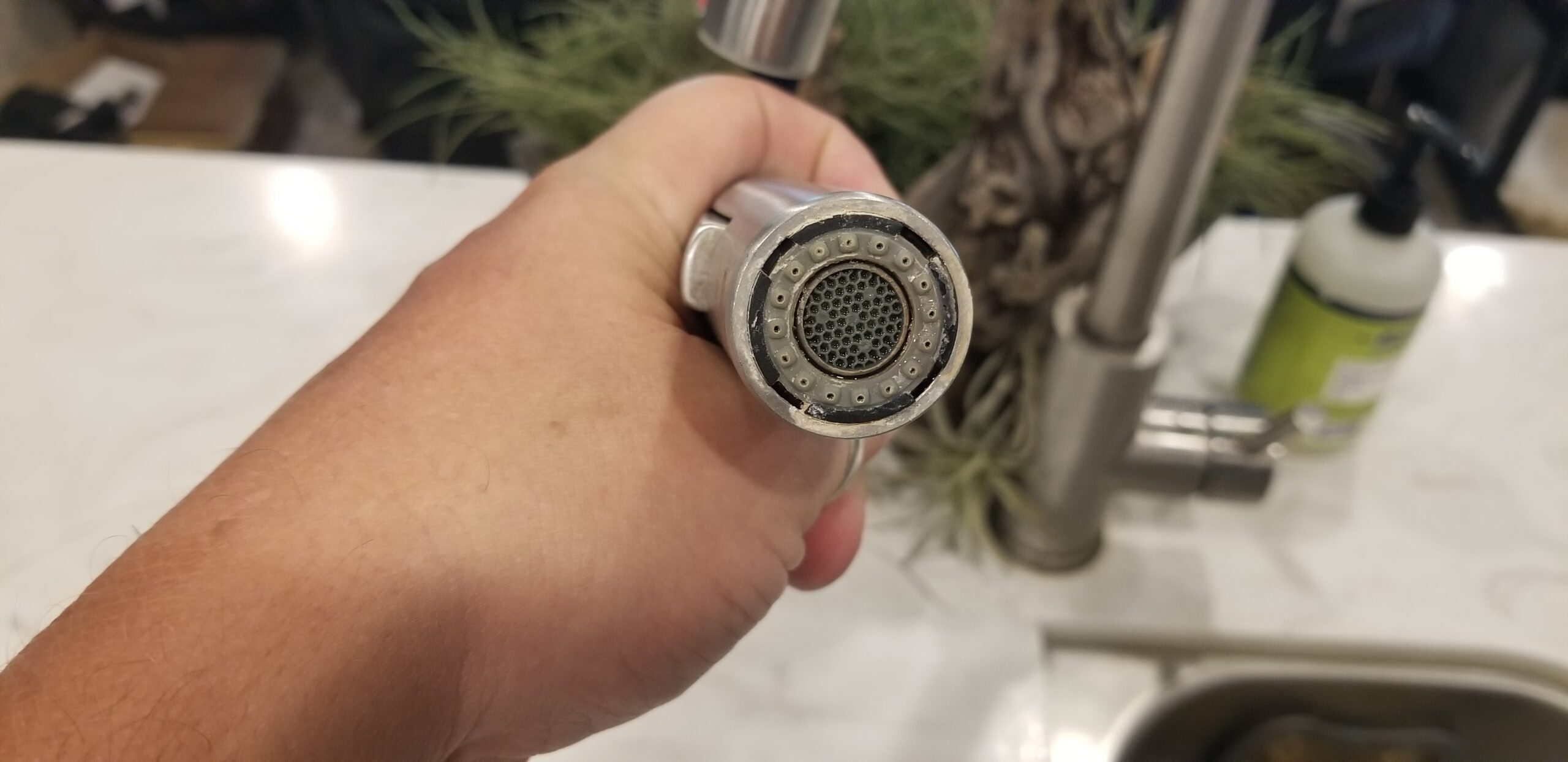 hand holding RV faucet