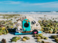 RV craft on beach - feature image for how to sell crafts while RVing