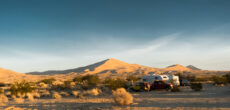 RV camping among dunes - feature image for new to RVing tips