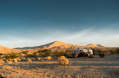 RV camping among dunes - feature image for new to RVing tips