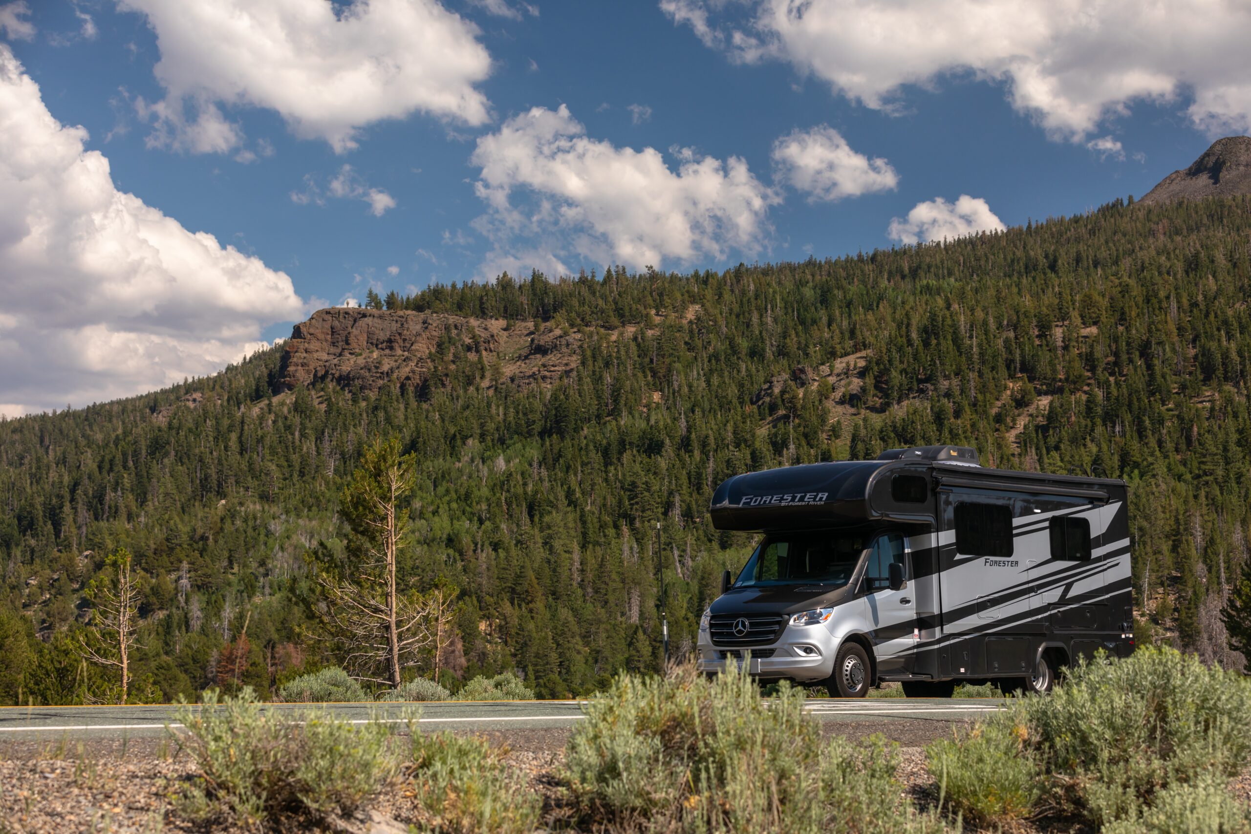 motorhome in campsite - feature image for cheap RV living forum tips
