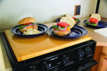 RV stove covers with burgers on top
