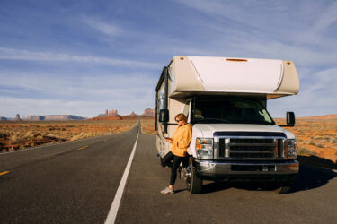 RV leaning on motorhome in the middle of nowhere