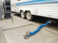 RV dump station with hose - feature image for RV tank sensors