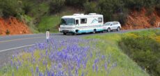 RV towing a car in US - feature image for how to move into an RV full time