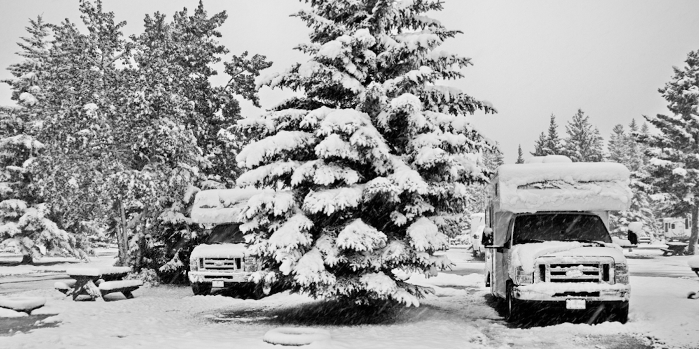 2 RVs in snow covered campground