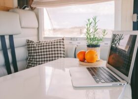 laptop in RV - feature image for how to organize tasks in RV