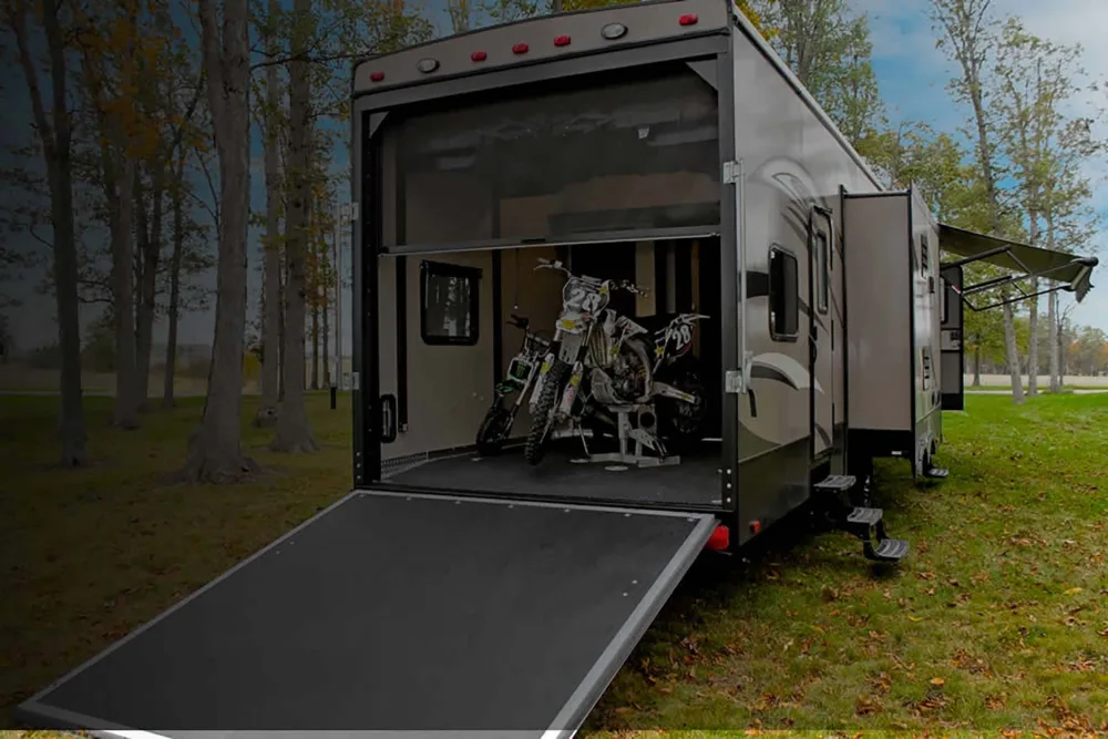 Toy Hauler with motorcyycles in it with rear ramp down and screen covering the opening RV toy hauler mods 