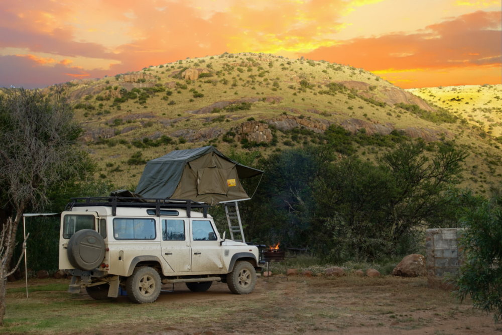 A Land Rover with a rooftop tent