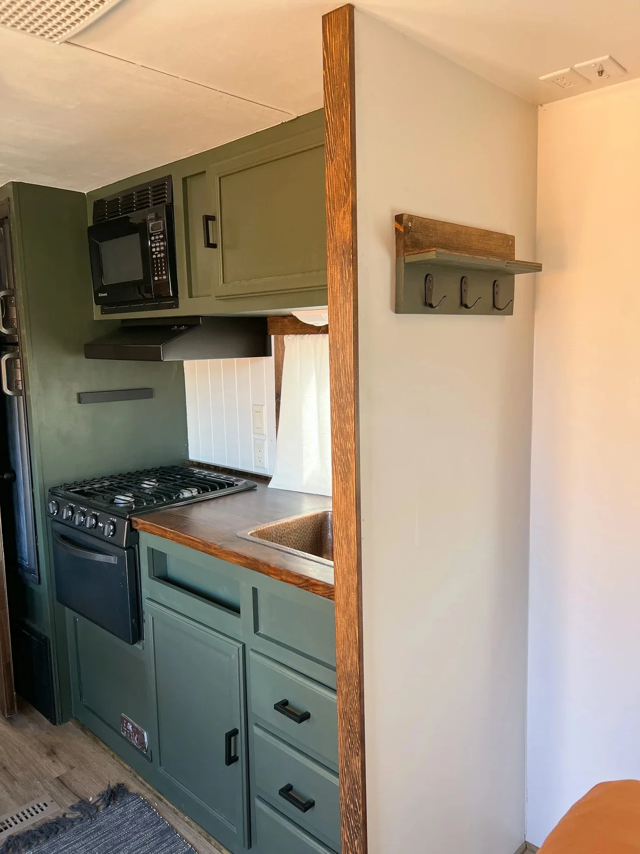 inside the kitchen in the renovated camper