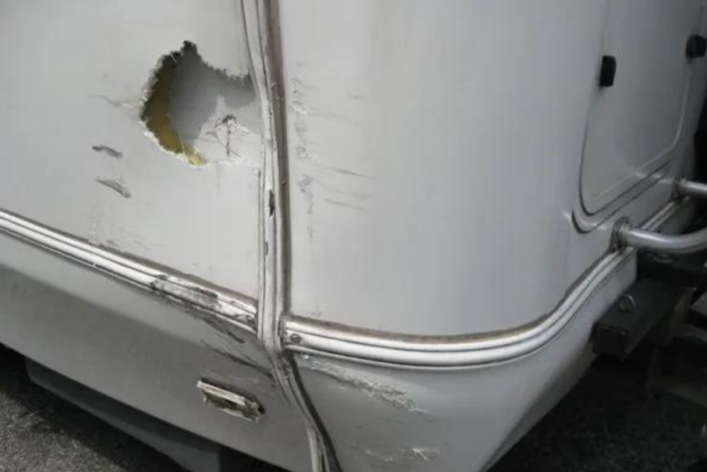 Damage to fiberglass from impact on RV side - delamination