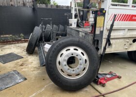 A mobile RV tire replacement vehicle loaded with tires.