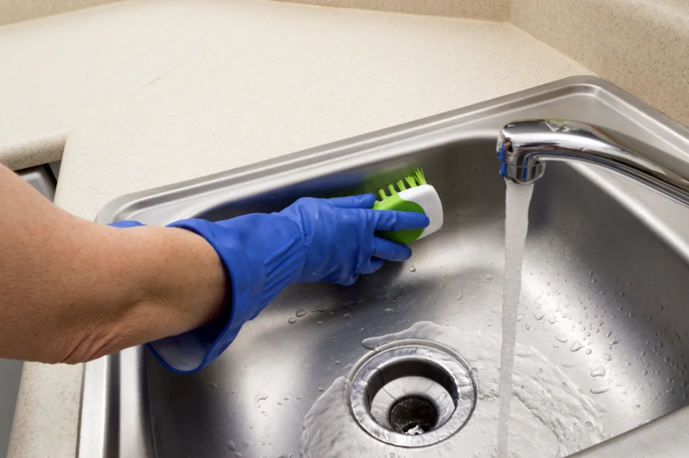 cleaning a sink, image for RV cleaning supplies