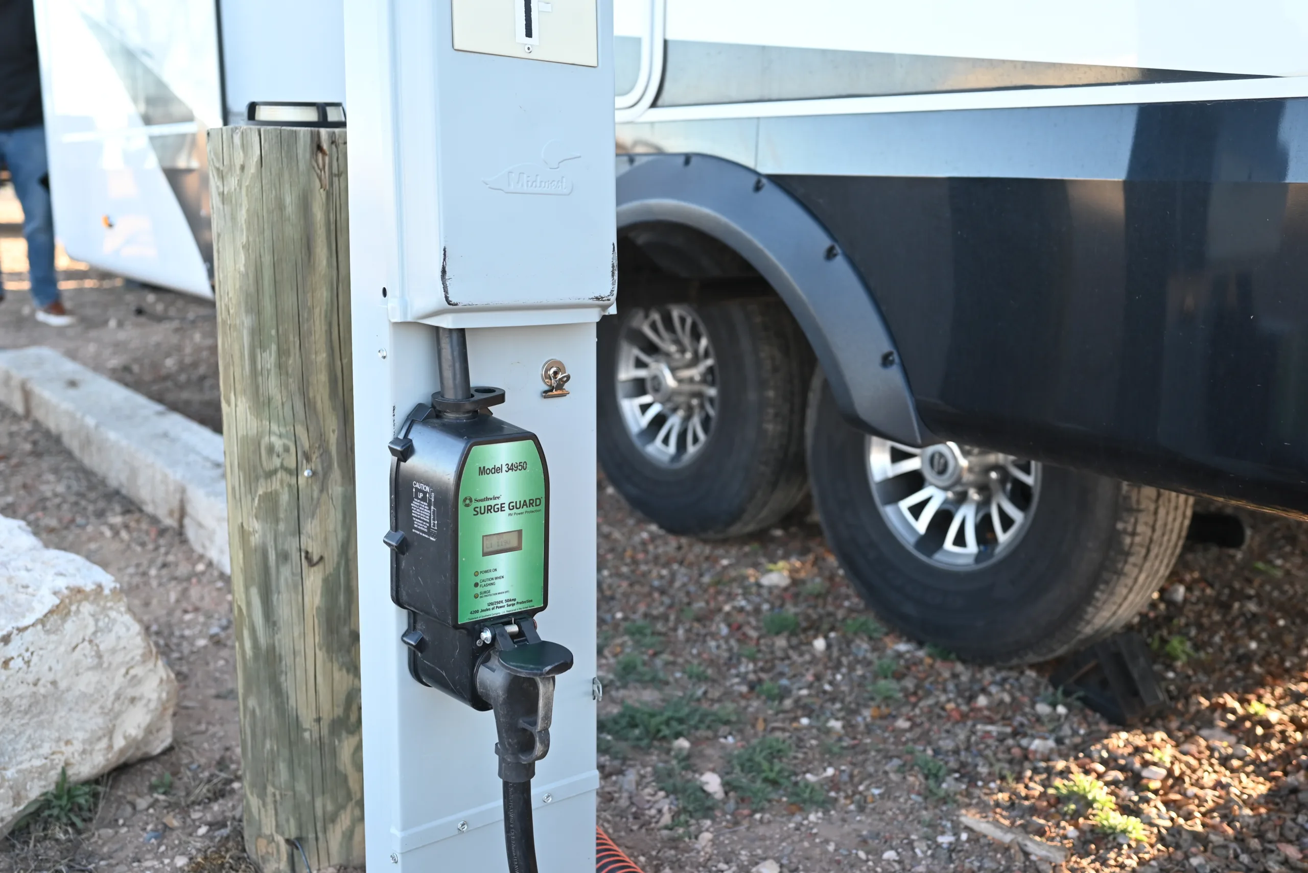 a close up of a gas pump attached to the side of a white truck parked on the side of a road, image for power outage article
