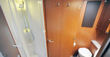 Camper bathroom with shower, toilet and sink
