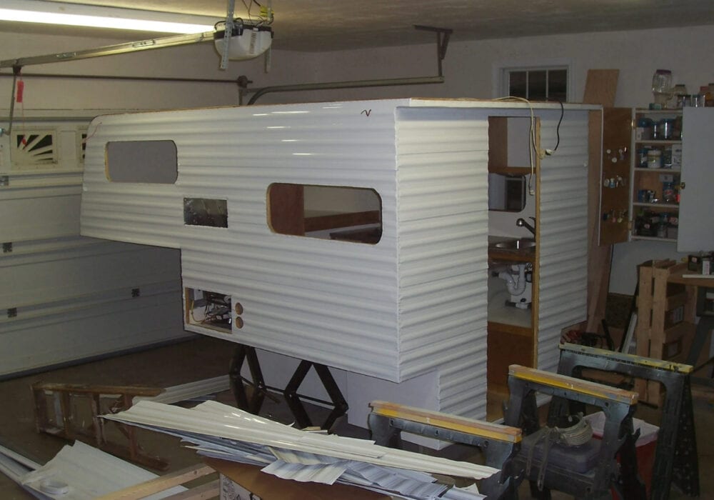 exterior finish of truck camper build set up in garage