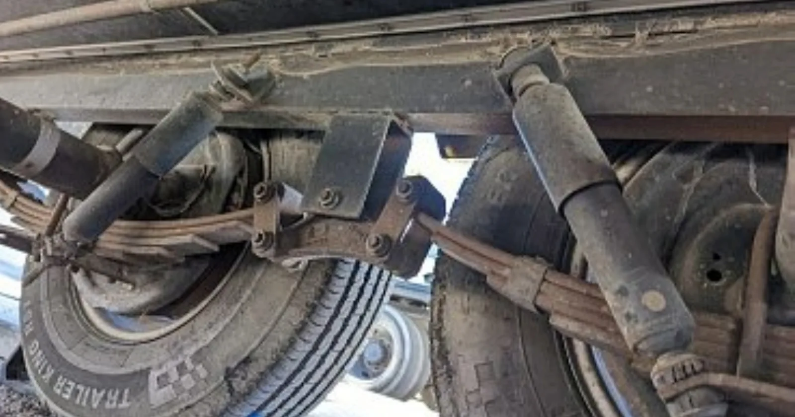 RV suspension system including the leaf springs, shocks and tires