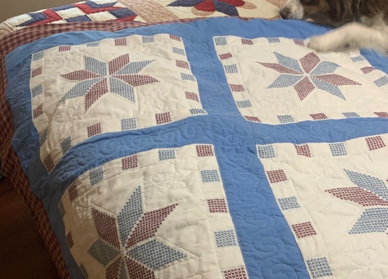 blue, maroon and white quilt